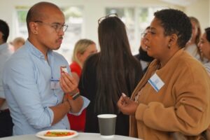 Two people talking during break